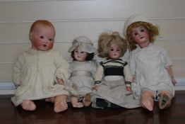 An Armand Marseille bisque head doll, no.331, with sleeping eyes, together with three other bisque