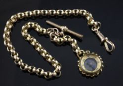 An Edwardian 9ct gold facetted link albert chain, hung with a 9ct gold compass charm, gross 21.7