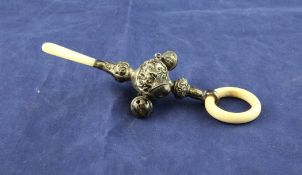 A George V repousse silver and mother of pearl mounted child`s rattle, with four bells and