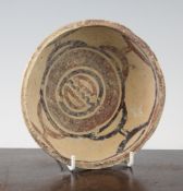 A Greek Daunian pottery bowl, c. 5th century BC, with slate blue and iron red geometric