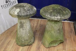 A pair of weathered staddle stones, with circular tops and conical tapering bases, H.2ft 5in.