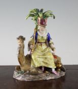 A 19th century Dresden porcelain group of Africa, seated on a camel, 6in. restored.