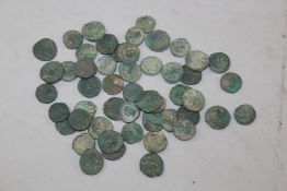 A collection Medieval Islamic bronze coins, each decorated with an elephant and inscriptions,