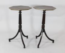 A pair of Regency style octagonal mahogany tripod wine tables, with brass edges, fluted columns,