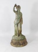 A cast iron garden figure of a classical maiden, holding a bunch of grapes, on a circular base, H.