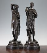 After Jean Jacques Pradier. A pair of bronze figures of classical women, on marble bases, both