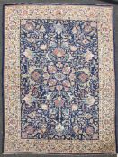 A north west Persian carpet, with polychrome field of geometric foliate motifs on a deep blue