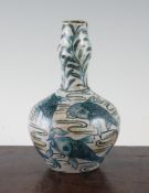 A William De Morgan Persian style bottle vase, Fulham period, c.1888-1897, decorated in green