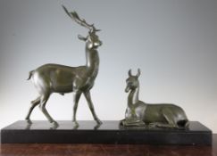 A 19th century French green patinated metal figure group, modelled as a stag and doe, on rectangular