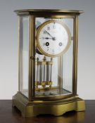 An early 20th century brass four glass mantel clock, with enamelled dial signed Maple & Co. Paris,