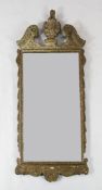 An 18th century carved and gilt wood wall mirror, with rectangular mirror plate glass, the