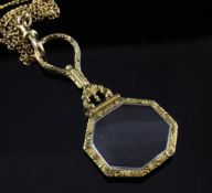 A gold overlaid octagonal spy glass, on a 9ct gold albert chain, chain 13.4 grams.