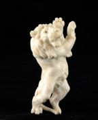 A 19th century carved ivory figure of a standing lion, 4.5in.