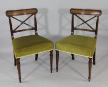 A set of six Regency mahogany dining chairs, with X shaped backs, padded seats and turned tapered