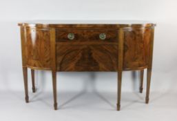 A George III style mahogany breakfront sideboard, with a frieze drawer over a single deep drawer