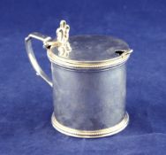 A Victorian silver drum mustard, with beaded borders and pierced thumbpiece, William Evans,
