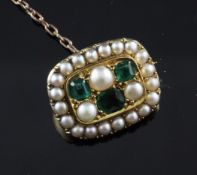 A 19th century gold, emerald and split pearl brooch, of rounded rectangular form, 0.75in