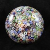 A Baccarat close packed millefiori paperweight, 19th century, dated cane rod for 1848, with