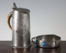 An Archibald Knox Liberty Tudric pewter jug, once having enamel roundels, no.0305, together with a