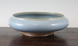 A Chinese Robin`s egg glazed shallow bowl, the unglazed base with impressed four character seal