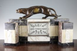 A French marble Art Deco clock garniture, the mantel clock with silvered rectangular dial and