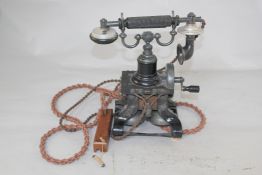 An early 20th century number 16 skeleton Ericson telephone, with black frame, twin bells, chords and