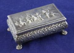 An early 20th century Dutch 833 standard silver box, of rectangular bombe form, the lid decorated