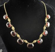 A Victorian 9ct gold and hessonite garnet fringe necklace, set with nine garnets and alternating