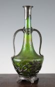 An Art Nouveau Kralik or Bohemian iridescent glass decanter, with pewter mounts, unmarked, 13in.