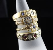 Three late 19th/early 20th century 18ct gold sapphire, diamond or seed pearl set dress rings and a