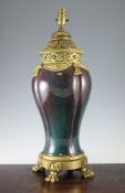 A Continental ormolu mounted flambe baluster lamp base, c.1900, of lobed form with green/reddish