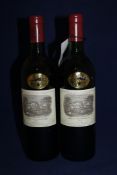 Two bottles of Chateau Lafite 1983, Premier Cru Classe, Pauillac; one high fill, one into neck,