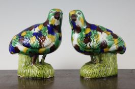 A pair of Chinese glazed biscuit porcelain figures of standing quail, decorated in sancai, 5.5in.