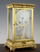 An early 20th century ormolu four glass mantel clock, with floral painted dial signed Seth Thomas