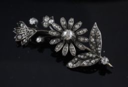 An Edwardian gold, silver and diamond set floral spray brooch, 2.25in.