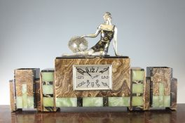 A French Art Deco marble and onyx clock garniture, mounted with a seated female holding a hat with a