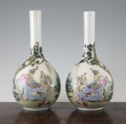 A pair of Chinese famille rose bottle vases, Qianlong mark but later, first half 20th century,