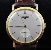 A gentleman`s 1960`s 18ct gold Longines manual wind wrist watch, with baton numerals, subsidiary