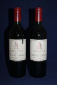 Two bottles of Chateau Latour 1970, Premier Cru Classe, Pauillac; one base of neck, tear to label;