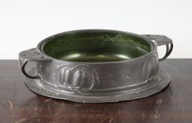 An Archibald Knox Liberty Tudric pewter circular butter dish, with green clutha glass liner, no.