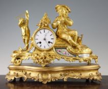 A 19th century French ormolu and Sevres style porcelain mantel clock, surmounted with a putto and