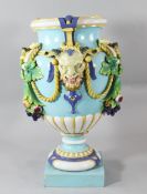 A massive Minton majolica urn, late 19th century, of oviform, modelled with satyr masks and rope