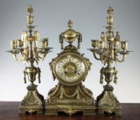 An early 20th century French gilt brass clock garniture by Henri Marc, with architectural case and