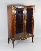 A Continental rosewood and kingwood brass mounted vitrine, with a pair of shaped glazed panelled