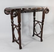 A 20th century Chinese hardwood altar table, with dragon pierced frieze and pierced twisted