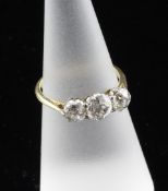 An 18ct gold and graduated three stone diamond ring, the total diamond weight estimated in excess of