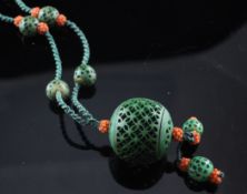 A Chinese coral, stained ivory and carved wood? bead set rope pendant necklace, 28in.