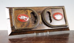 A Victorian burr walnut bookslide, each end with oval porcelain mounts and twisted brass border,