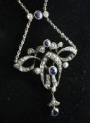 An Edwardian Art Nouveau gold, silver, sapphire and diamond set drop pendant necklace, of stylised