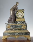 A 19th century French ormolu mounted green marble mantel clock, surmounted with a figure of a